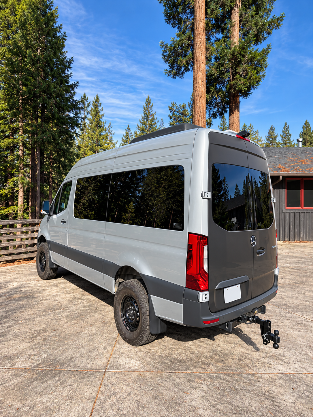 Our silver Mercedes-Benz passenger van among Anderson Valley redwoods